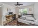 Bedroom with a desk, chair, and light from the window at 9481 Highland Oak Dr # 710, Tampa, FL 33647