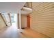 Exterior view of the condo building featuring stairs and a landing with an orange front door at 9481 Highland Oak Dr # 710, Tampa, FL 33647