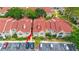 Exterior of condo unit with assigned parking spaces; manicured landscaping enhances curb appeal at 9481 Highland Oak Dr # 710, Tampa, FL 33647