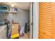 A utility area with shelving and laundry appliances at 9481 Highland Oak Dr # 710, Tampa, FL 33647