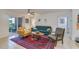 Bright living room featuring neutral walls, ceiling fan, rug, and access to the outdoor patio at 9481 Highland Oak Dr # 710, Tampa, FL 33647