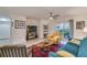 Cozy living room boasting a ceiling fan and sliding doors to the patio at 9481 Highland Oak Dr # 710, Tampa, FL 33647