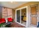 Patio featuring tiled flooring, patio furniture, and sliding glass doors leading to the living area at 9481 Highland Oak Dr # 710, Tampa, FL 33647