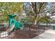 Community playground features a slide, swings, and a climbing structure for to enjoy at 9481 Highland Oak Dr # 710, Tampa, FL 33647