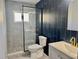 This modern bathroom features new tile, shower, toilet and sink at 9893 86Th N Way, Seminole, FL 33777