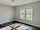 This is a bright bedroom with a ceiling fan and hardwood floors at 9893 86Th N Way, Seminole, FL 33777