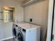 This laundry room features a washer and dryer at 9893 86Th N Way, Seminole, FL 33777