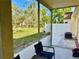 This screened-in patio offers views of the backyard at 9893 86Th N Way, Seminole, FL 33777