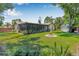 Expansive backyard with a screened-in porch and fire pit, perfect for outdoor entertaining at 9981 58Th N St, Pinellas Park, FL 33782