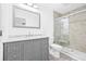 Updated bathroom features a gray vanity with marble countertop and a modern glass-enclosed shower at 9981 58Th N St, Pinellas Park, FL 33782