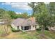 Aerial view of home featuring a screened in porch and a large, green backyard at 10150 Heather Sound Dr, Tampa, FL 33647