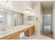Spacious bathroom with double sinks, large vanity mirror, and tile flooring at 10150 Heather Sound Dr, Tampa, FL 33647
