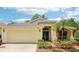 Charming single-story home featuring a two-car garage, well-maintained landscaping, and a welcoming entrance at 10150 Heather Sound Dr, Tampa, FL 33647