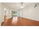 Bright and airy living space with wood floors and a sliding glass door that leads to the patio at 10150 Heather Sound Dr, Tampa, FL 33647