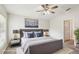 Cozy bedroom featuring a comfortable bed with modern lamps on mirrored bedside tables at 10150 Heather Sound Dr, Tampa, FL 33647