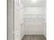 Walk-in closet featuring neutral carpet and wire rack shelving at 10150 Heather Sound Dr, Tampa, FL 33647