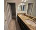 Bathroom featuring double vanity with granite countertop and tile flooring at 1022 Oliveto Verdi Ct, Brandon, FL 33511