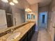 Bathroom featuring double vanity with granite countertop, and tile flooring at 1022 Oliveto Verdi Ct, Brandon, FL 33511