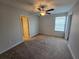 Bedroom featuring a ceiling fan, carpet and a window for natural light at 1022 Oliveto Verdi Ct, Brandon, FL 33511