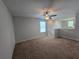 Bonus room area with carpet flooring and natural light from the windows at 1022 Oliveto Verdi Ct, Brandon, FL 33511