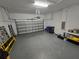 Spacious two car garage with high ceilings and an automatic door at 1022 Oliveto Verdi Ct, Brandon, FL 33511