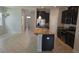Kitchen featuring granite countertops, stainless steel appliances, and an island with a sink at 1022 Oliveto Verdi Ct, Brandon, FL 33511