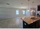 Open concept with granite countertops and dark cabinetry, seamlessly connecting to the living space at 1022 Oliveto Verdi Ct, Brandon, FL 33511