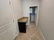 Bright laundry room with granite countertop folding station and modern appliances at 1022 Oliveto Verdi Ct, Brandon, FL 33511