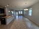 Open-concept living space featuring tile flooring, neutral walls, and abundant natural light from windows at 1022 Oliveto Verdi Ct, Brandon, FL 33511