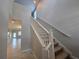 Bright staircase with neutral walls and carpeted steps, leading to the upper level of the home at 1022 Oliveto Verdi Ct, Brandon, FL 33511