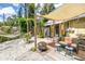 Charming backyard with a cozy seating area, hammock, and shade, creating a relaxing outdoor retreat at 1038 Crescent Lake N Dr, St Petersburg, FL 33701
