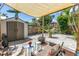 Private backyard patio features a storage shed, stylish seating, and a fire pit, ideal for enjoying the outdoors at 1038 Crescent Lake N Dr, St Petersburg, FL 33701