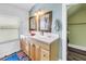 Bathroom featuring a double sink vanity with modern fixtures and rustic mirror frames at 1038 Crescent Lake N Dr, St Petersburg, FL 33701