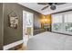 Comfortable bedroom featuring a ceiling fan, windows, and doorway to the bathroom at 1038 Crescent Lake N Dr, St Petersburg, FL 33701