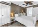 Cozy bedroom with a bed, linens, nightstand, and a door to the balcony at 1038 Crescent Lake N Dr, St Petersburg, FL 33701