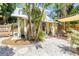 Charming home with a cozy backyard patio and lush landscaping, perfect for relaxation and outdoor living at 1038 Crescent Lake N Dr, St Petersburg, FL 33701