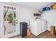 Laundry room with tile floors, a washer, a dryer, and outdoor access at 1038 Crescent Lake N Dr, St Petersburg, FL 33701