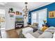 Cozy living room featuring blue accent wall, modern decor, and comfortable seating at 1038 Crescent Lake N Dr, St Petersburg, FL 33701