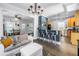 Open-concept living space with a modern kitchen, a breakfast bar, and a comfortable seating area at 1038 Crescent Lake N Dr, St Petersburg, FL 33701