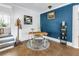 Bright office area with a modern desk, complemented by a blue accent wall and stylish decor at 1038 Crescent Lake N Dr, St Petersburg, FL 33701