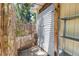 Private outdoor shower with wood beams and tropical foliage for added privacy at 1038 Crescent Lake N Dr, St Petersburg, FL 33701