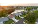 Aerial view of a neighborhood, showcasing the home's location, surrounding greenery, and nearby waterways at 10430 42Nd N St, Clearwater, FL 33762