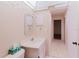Neutral bathroom featuring vanity with sink, toilet, decorative border, and a mirrored medicine cabinet at 10430 42Nd N St, Clearwater, FL 33762