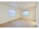 Bedroom with two windows providing plenty of natural light and neutral carpeting at 10430 42Nd N St, Clearwater, FL 33762