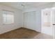 Bedroom with carpet, ceiling fan, large closet with bi-fold doors, and window with blinds at 10430 42Nd N St, Clearwater, FL 33762