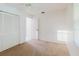 Neutral bedroom with carpet, a ceiling fan, and closet with bi-fold doors, leading to the ensuite bathroom at 10430 42Nd N St, Clearwater, FL 33762