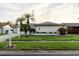 Charming single-story home with a well-manicured lawn and mature landscaping at 10430 42Nd N St, Clearwater, FL 33762