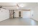 Clean, well-lit garage with water heater, storage space, and access door at 10430 42Nd N St, Clearwater, FL 33762