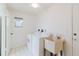 Clean and tidy laundry room with washer, dryer, and utility sink at 10430 42Nd N St, Clearwater, FL 33762
