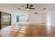 A bright, spacious living room with tile flooring and modern ceiling fans is great for entertaining at 10430 42Nd N St, Clearwater, FL 33762